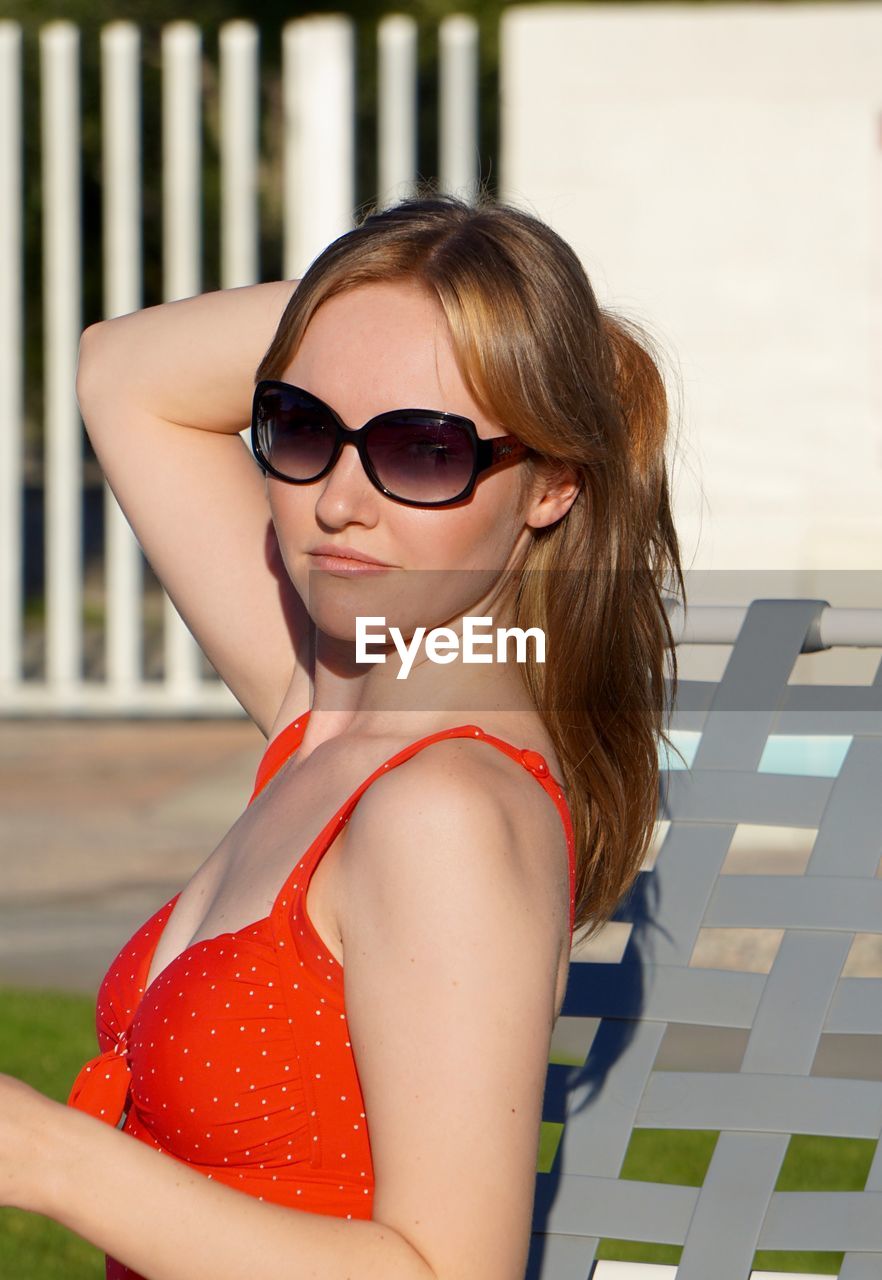 Portrait of young woman wearing sunglasses