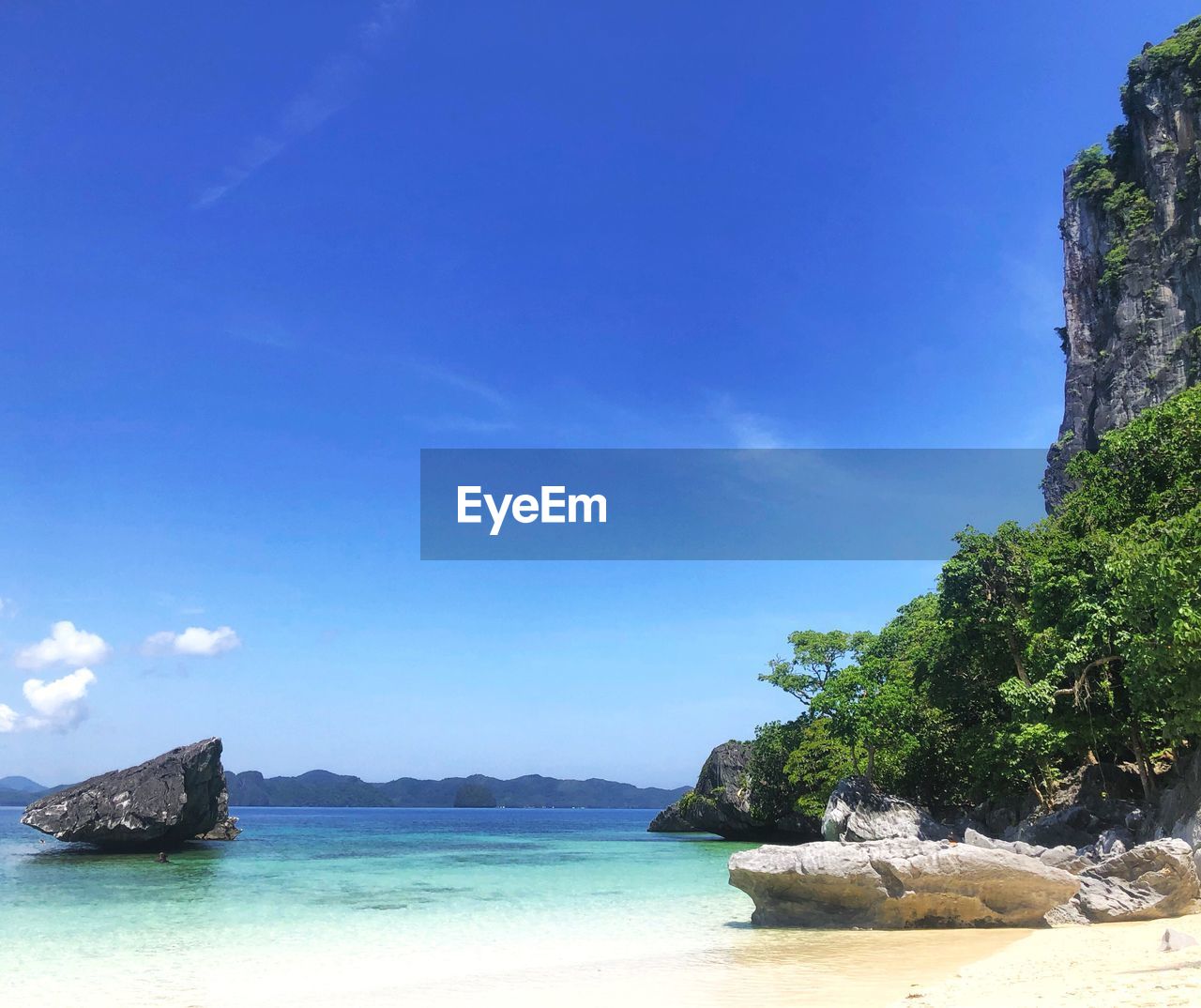 Scenic view of sea against blue sky