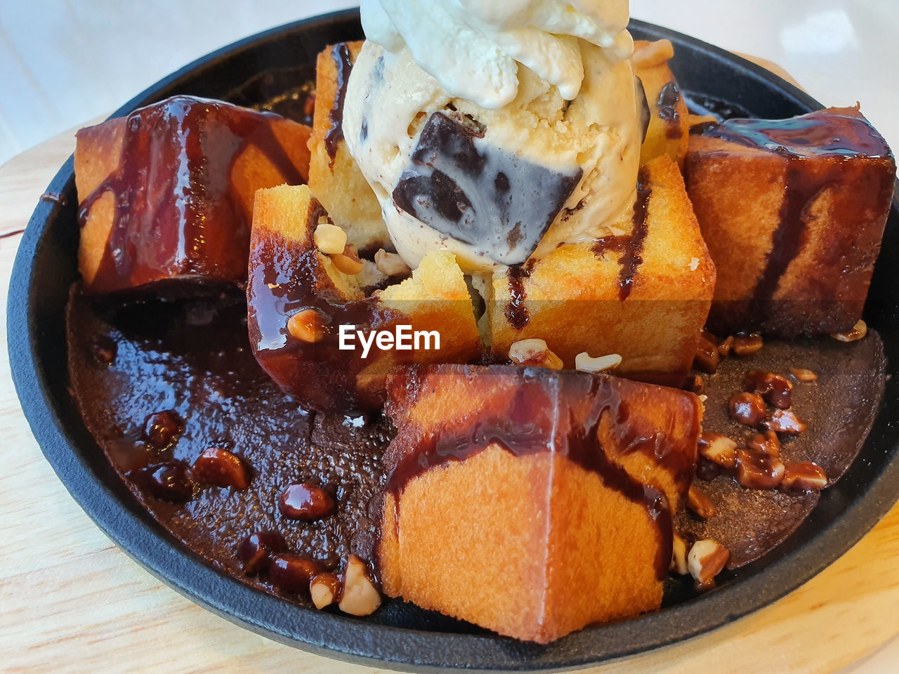 High angle view of ice cream and honey toast in plate on table