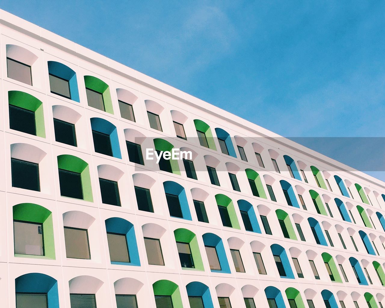 Low angle view of building against blue sky