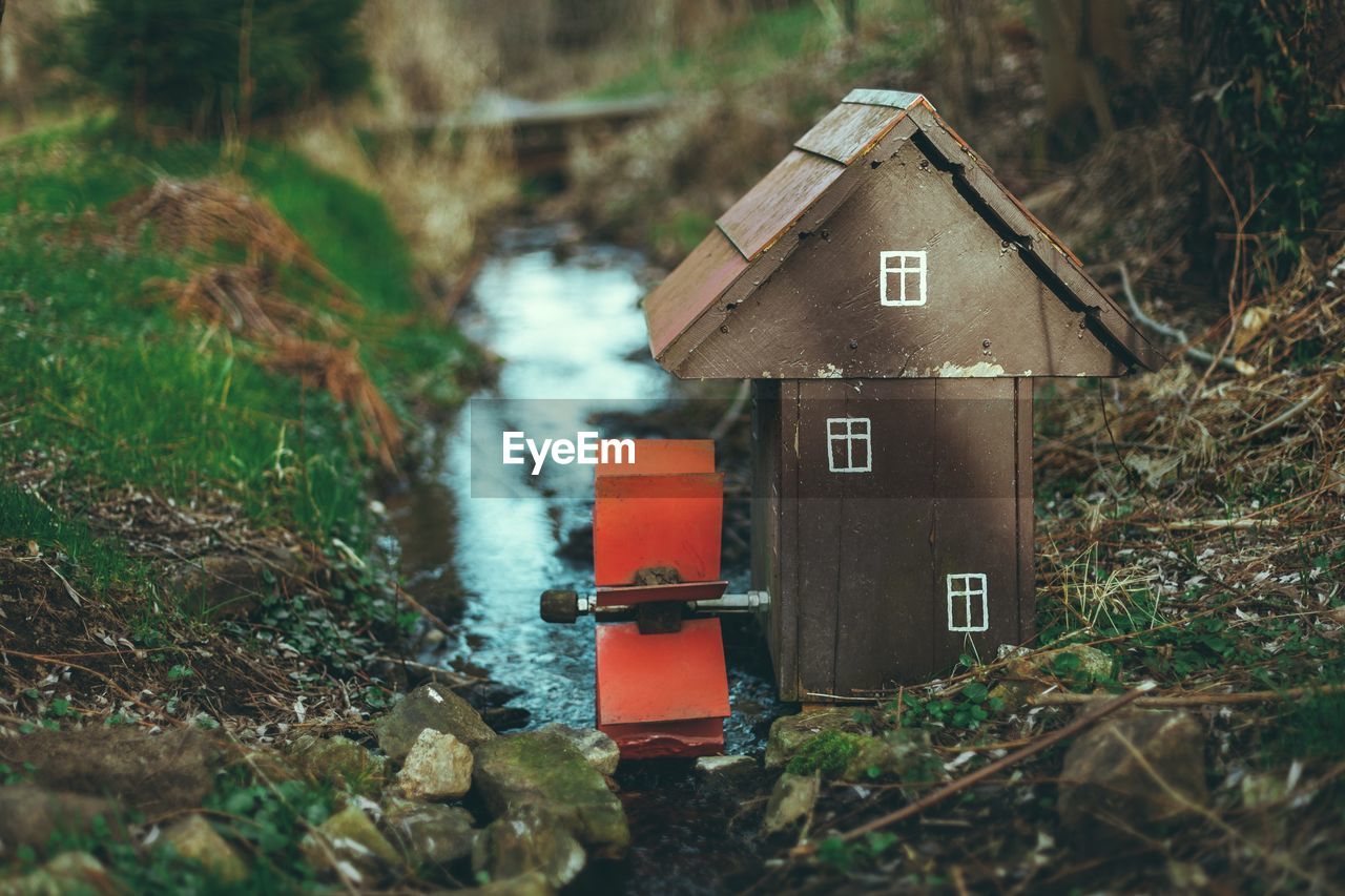 Miniature of a water mill on a stream