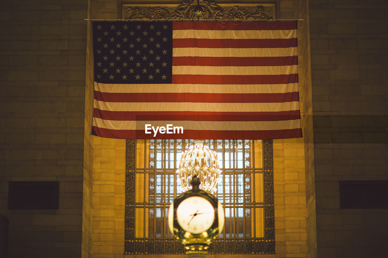 CLOSE-UP OF FLAG AGAINST BUILDING