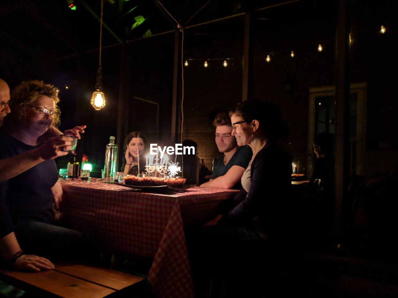 People sitting in restaurant at night