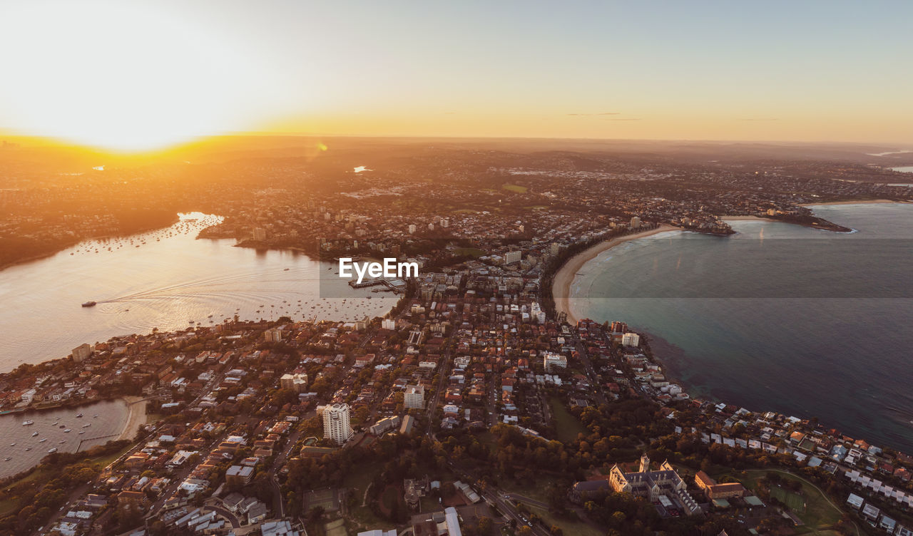 Drone sunset view of manly, an affluent seaside suburb of sydney, new south wales, australia. 