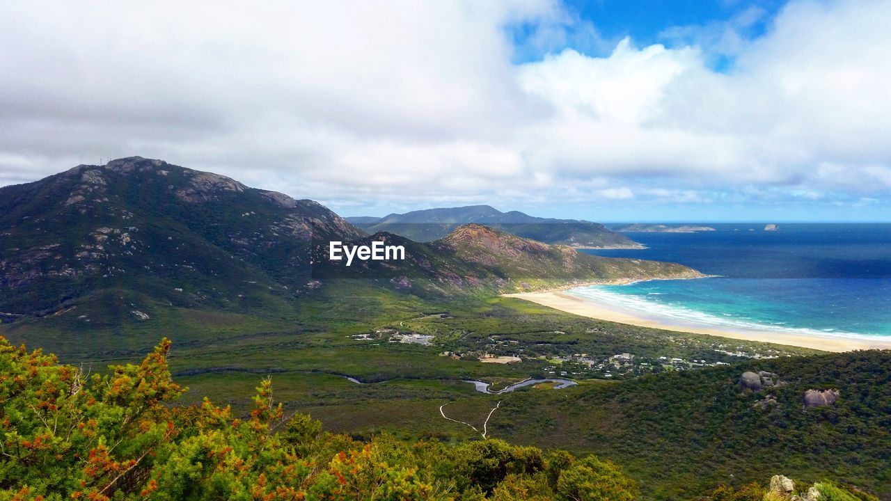 Scenic view of sea against cloudy sky