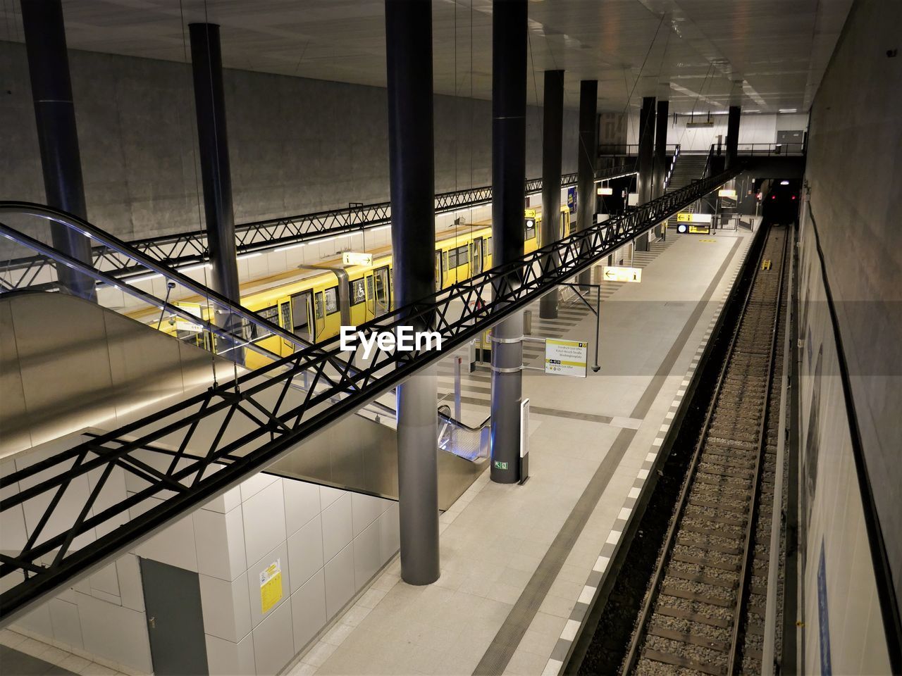 The view into a subway station in berlin at night without people or passengers. 