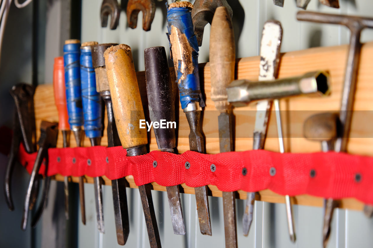 Close-up of tools collection in row