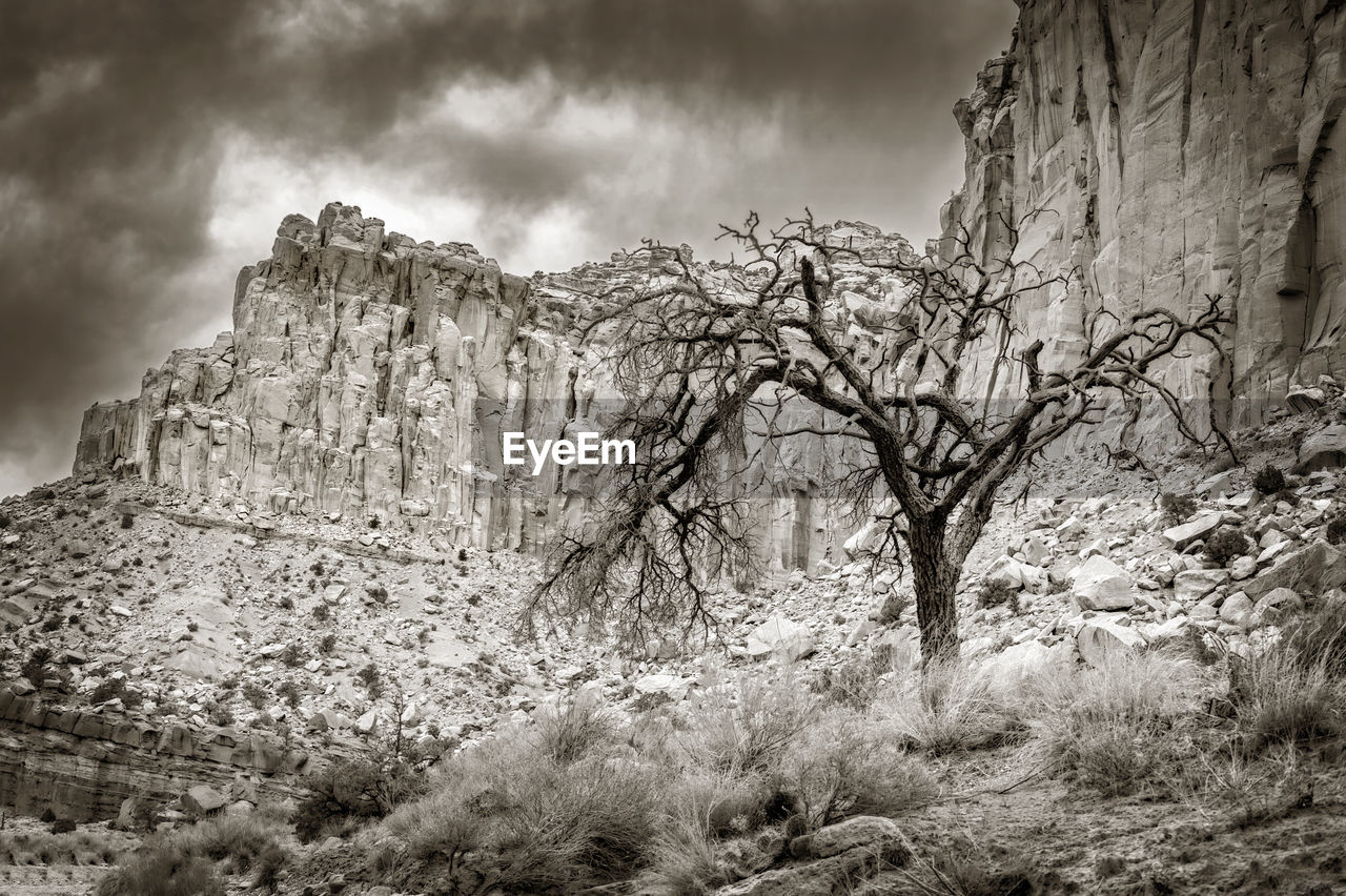 VIEW OF ROCK FORMATION ON LAND AGAINST SKY