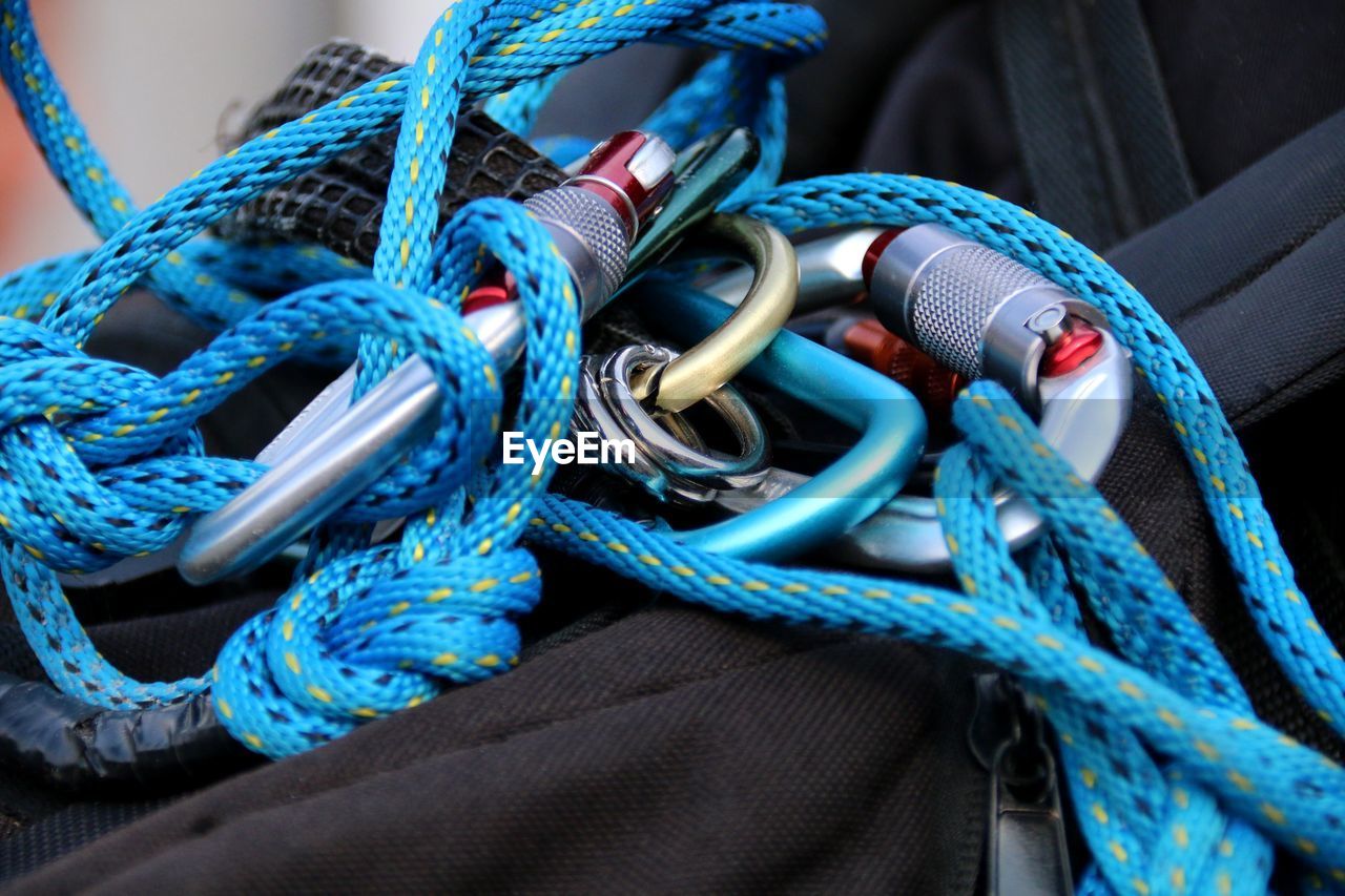 Close-up of blue climbing rope on bag