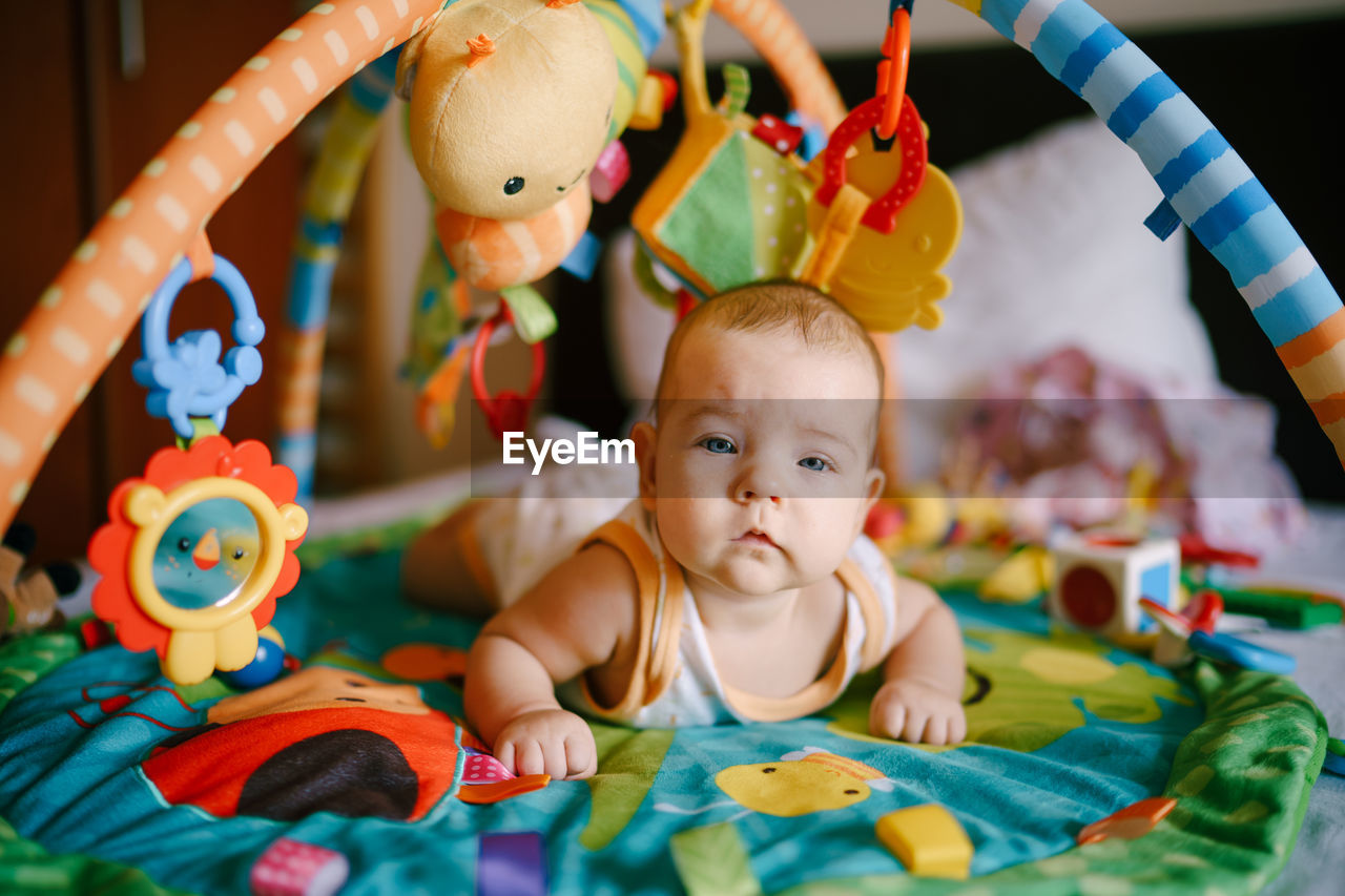 Close-up portrait of cute baby toys