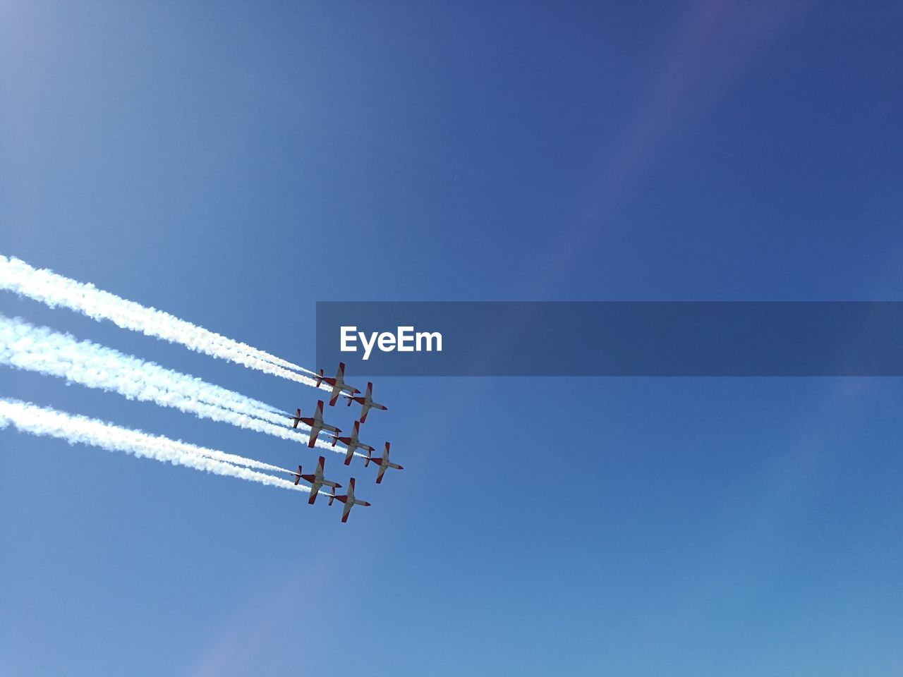 LOW ANGLE VIEW OF AIRPLANE FLYING IN SKY