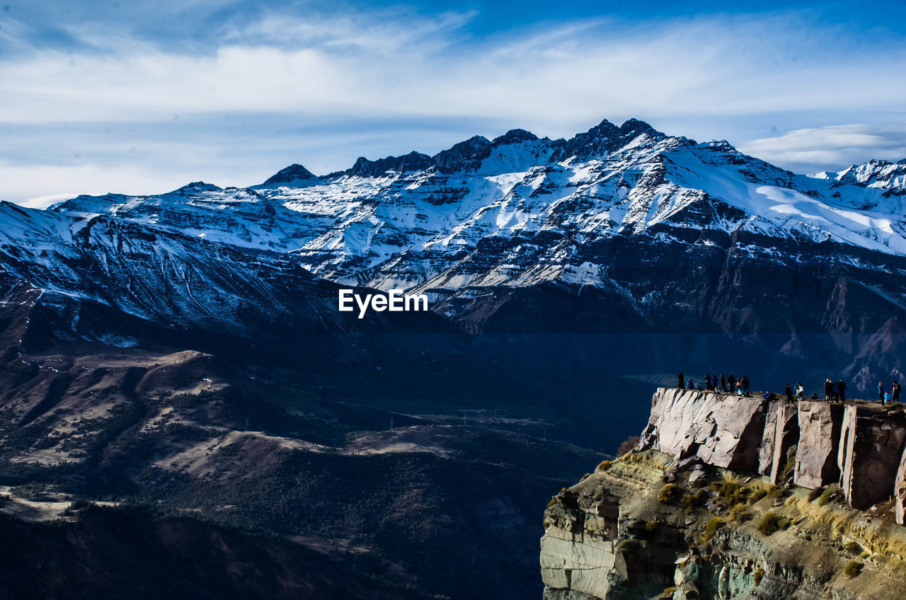 Scenic view of snowcapped mountains against sky