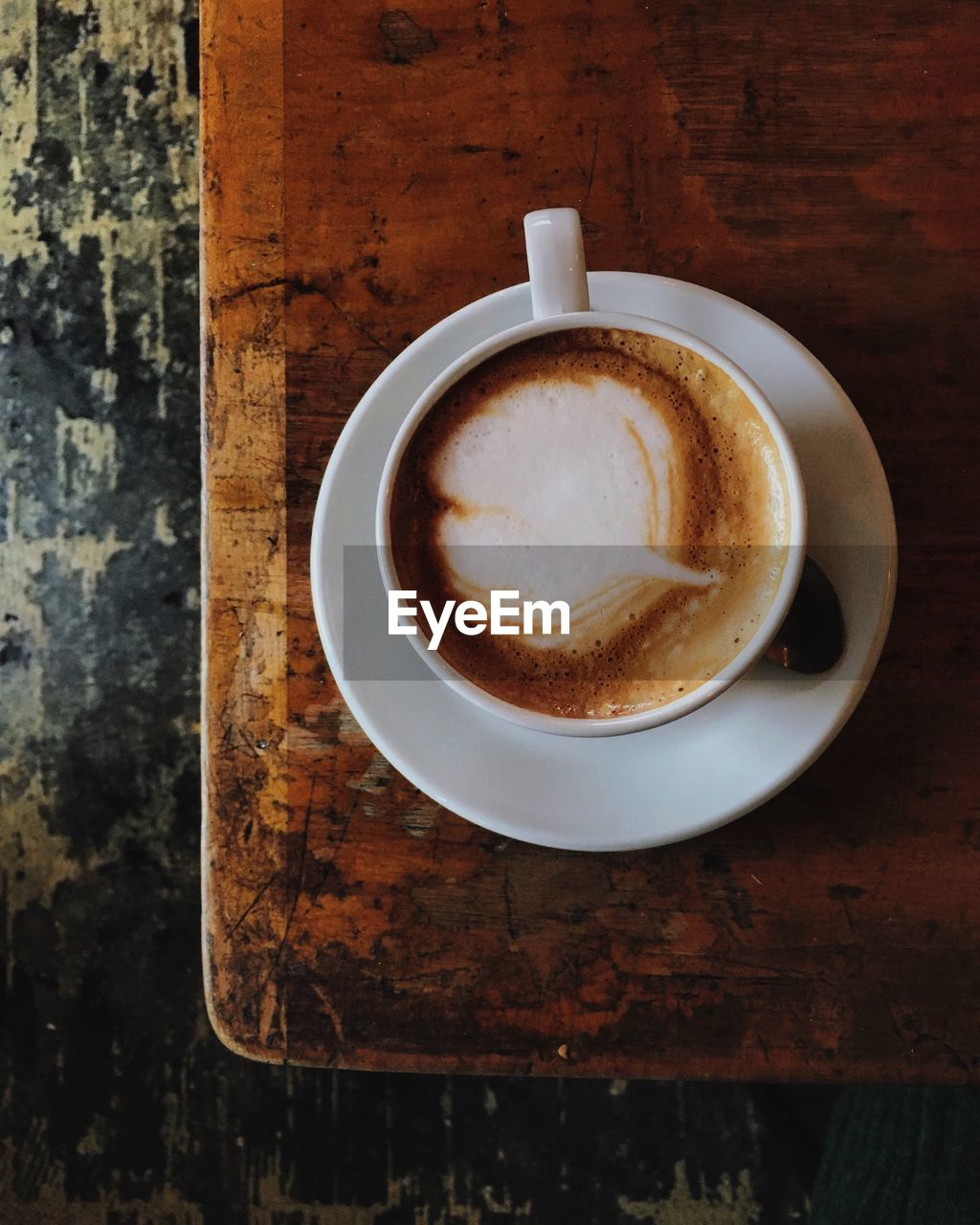 Directly above shot of coffee cup on table