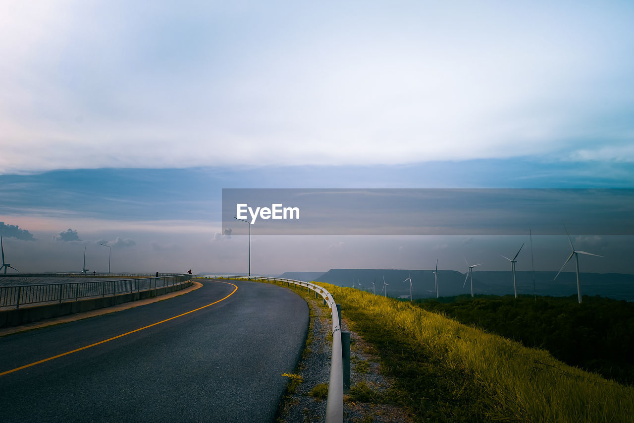 Road amidst landscape against sky