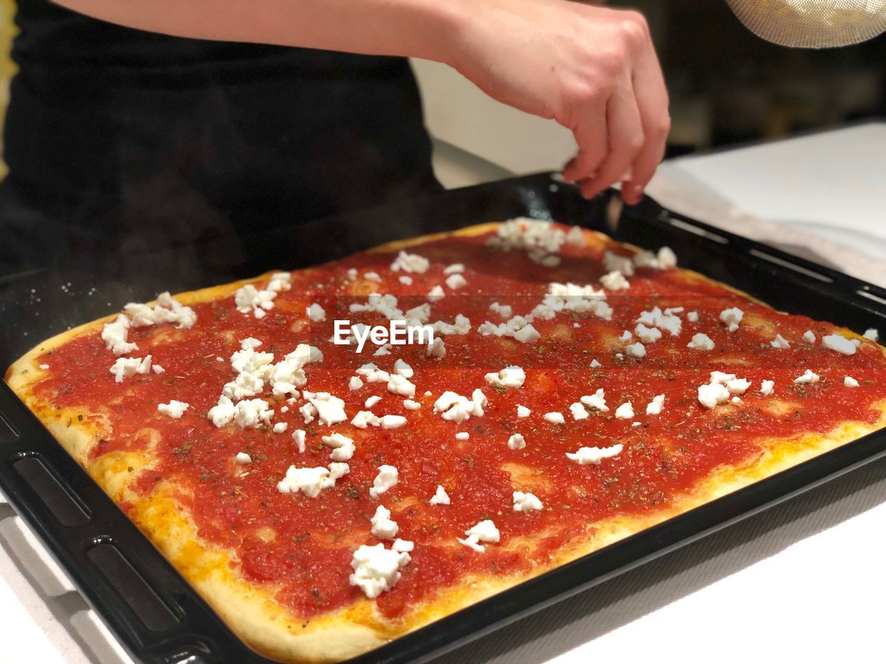 Midsection of person preparing food