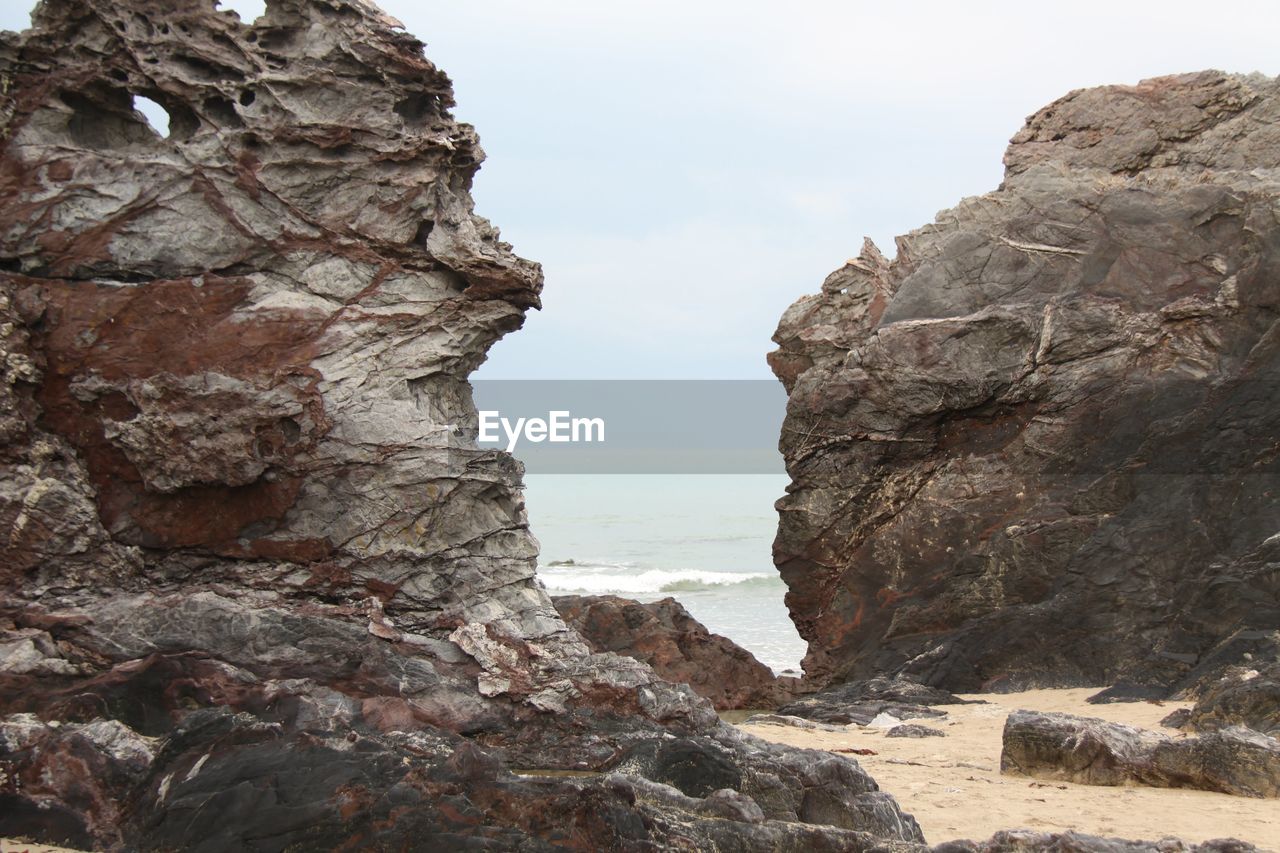 ROCK FORMATIONS ON BEACH