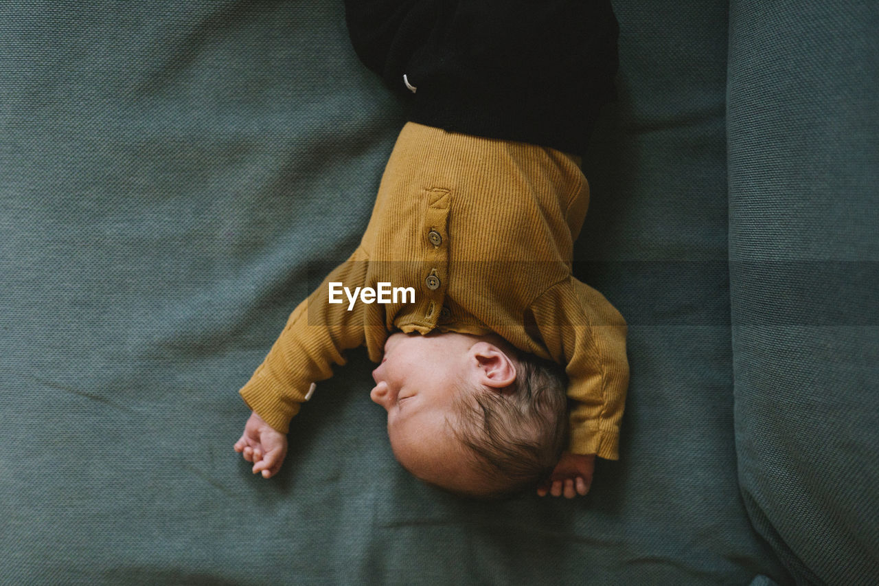 High angle view of baby sleeping