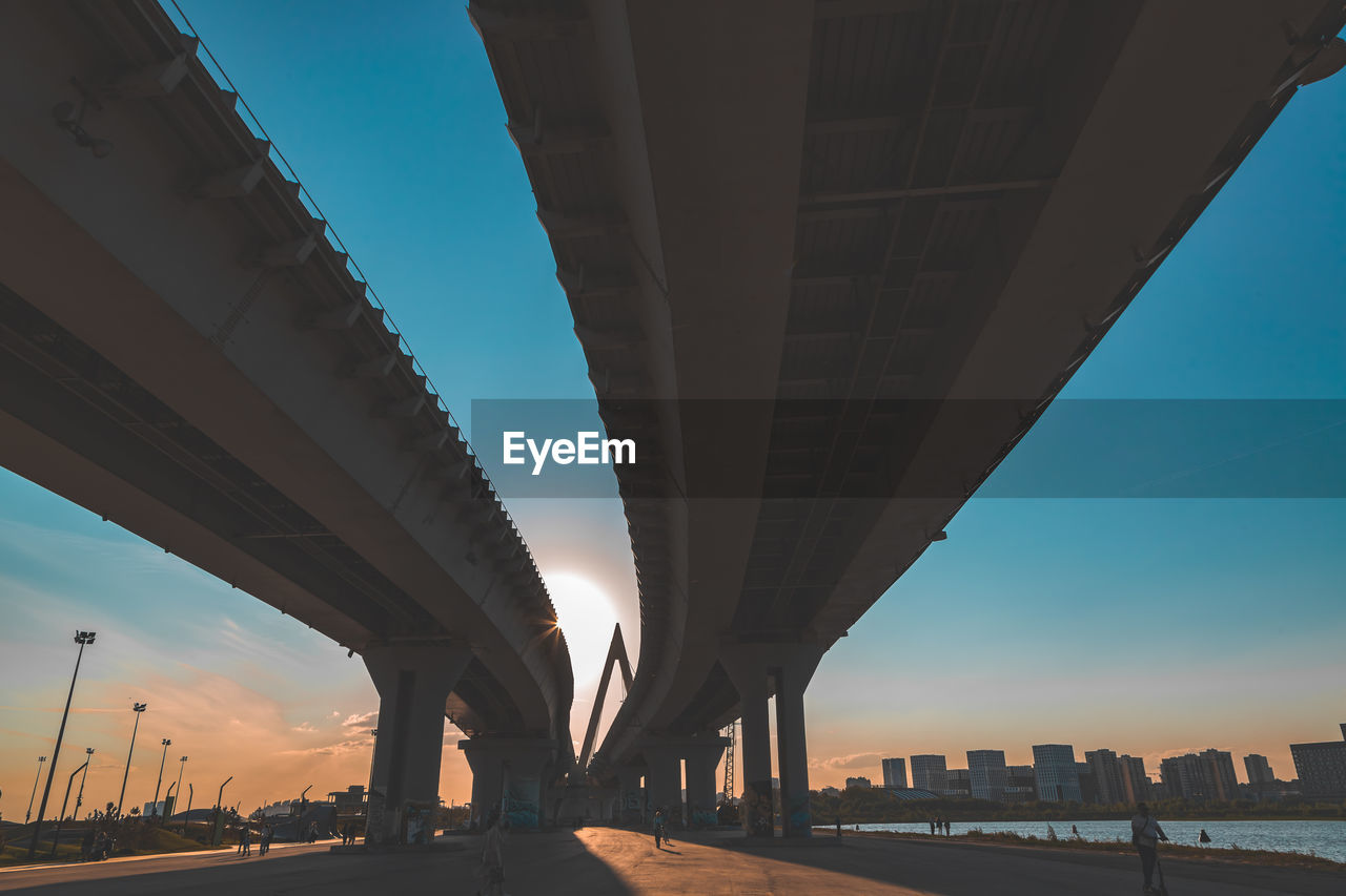 Low angle view of elevated road against sky