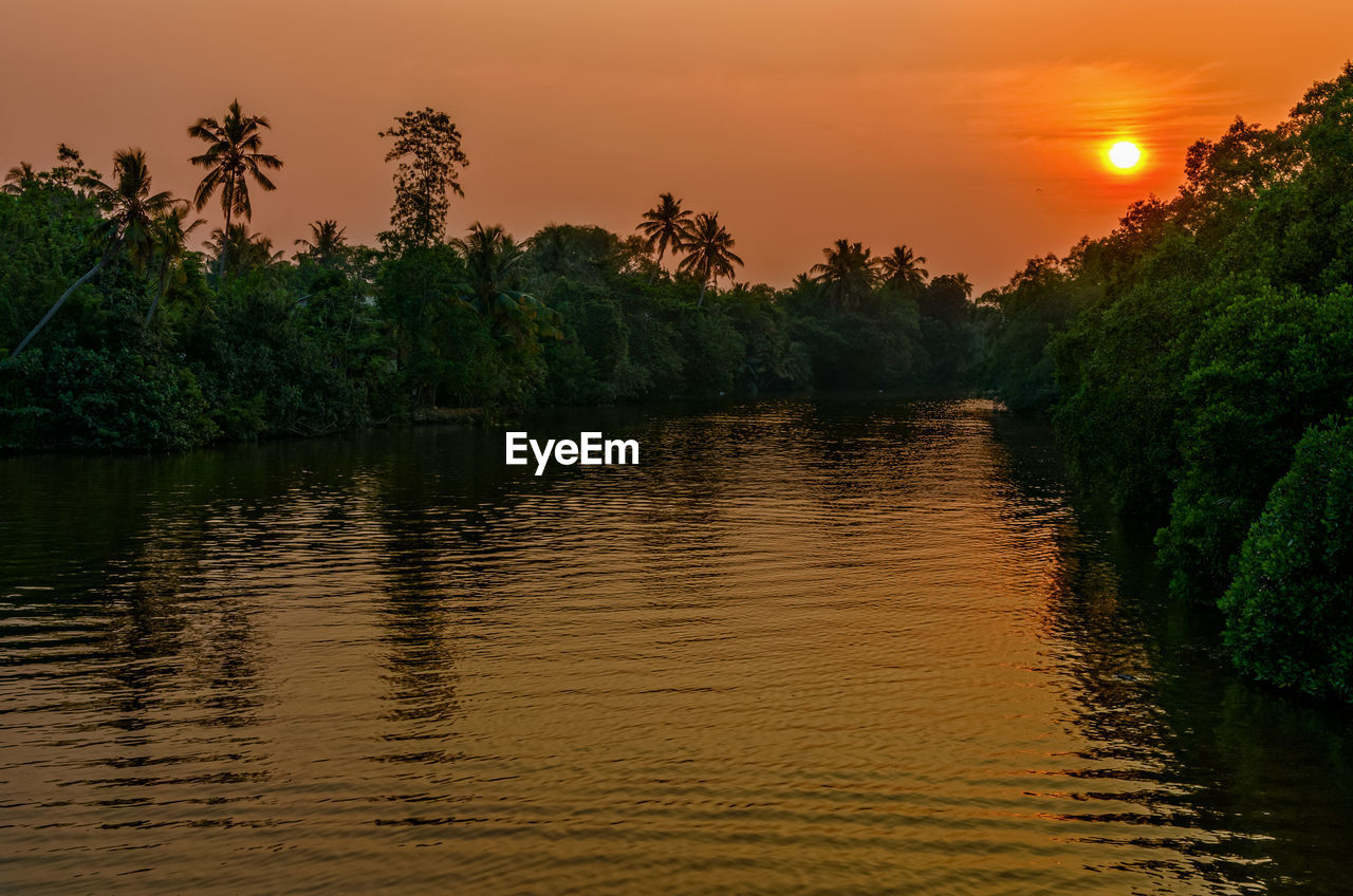 SCENIC VIEW OF LAKE DURING SUNSET