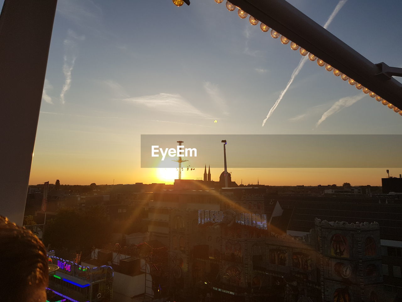 BUILDINGS AGAINST SKY DURING SUNSET