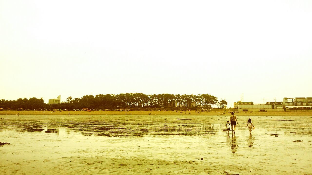 WOMAN STANDING ON SHORE