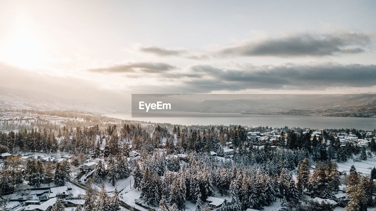 Scenic view of frozen lake against sky during winter
