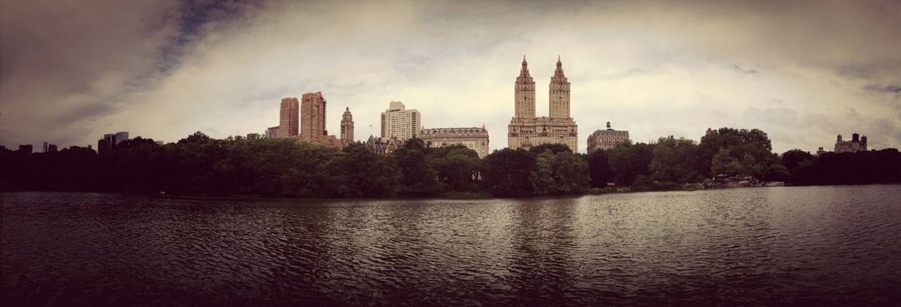 VIEW OF RIVER WITH BUILDINGS IN BACKGROUND