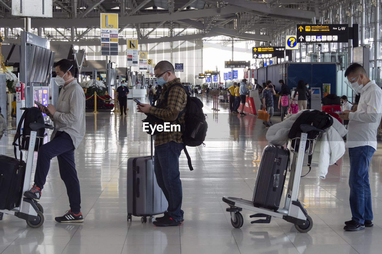 GROUP OF PEOPLE AT THE AIRPORT