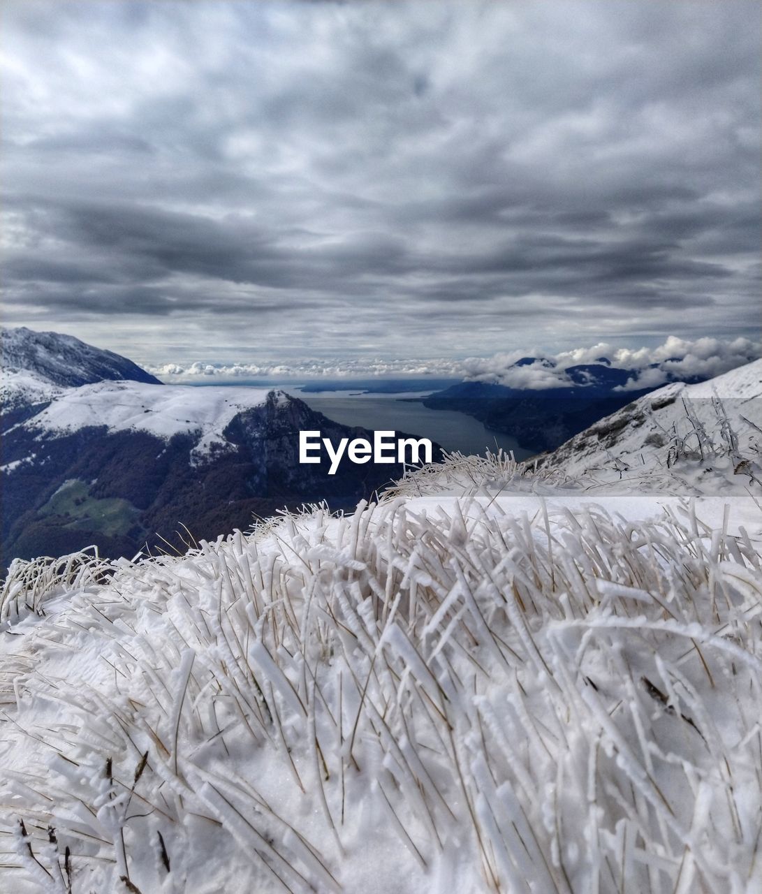 SNOW COVERED LANDSCAPE AGAINST SKY