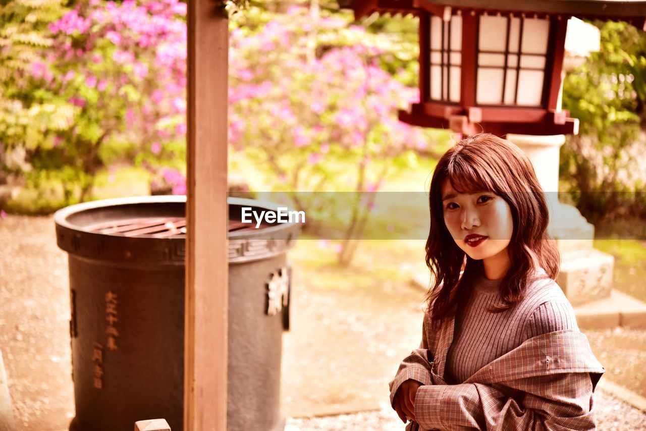 Portrait of young woman at shrine 