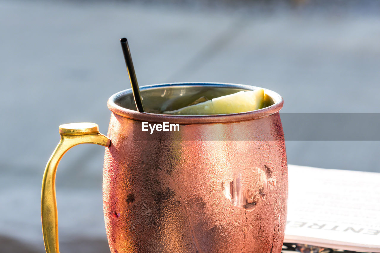 Closeup of a moscow mule mixed drink in a copper mug