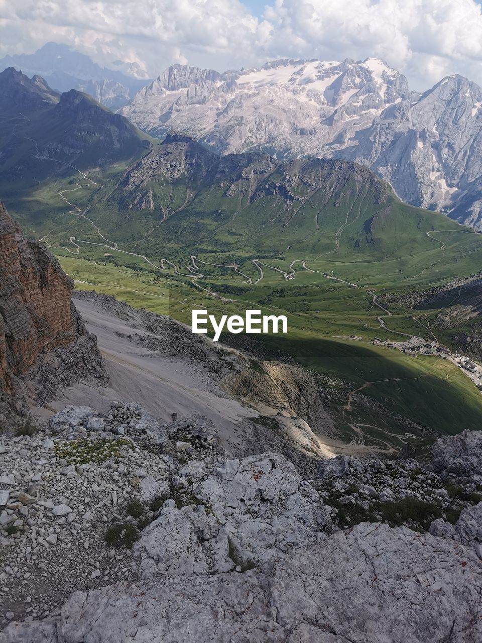 mountain, environment, scenics - nature, landscape, beauty in nature, mountain range, mountain pass, nature, land, valley, snow, sky, cloud, ridge, cold temperature, wilderness, tranquility, tranquil scene, no people, travel, travel destinations, walking, non-urban scene, moraine, winter, rock, adventure, plateau, day, highland, outdoors, snowcapped mountain, tourism, idyllic, plant, road, water, mountain peak, physical geography, geology, remote