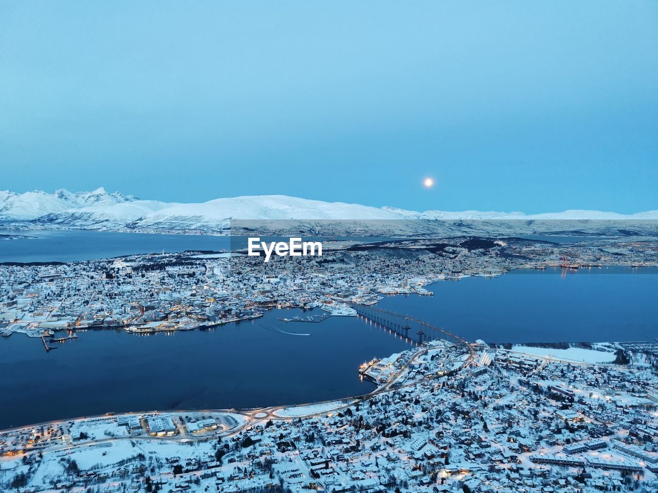 Scenic view of sea against blue sky during winter