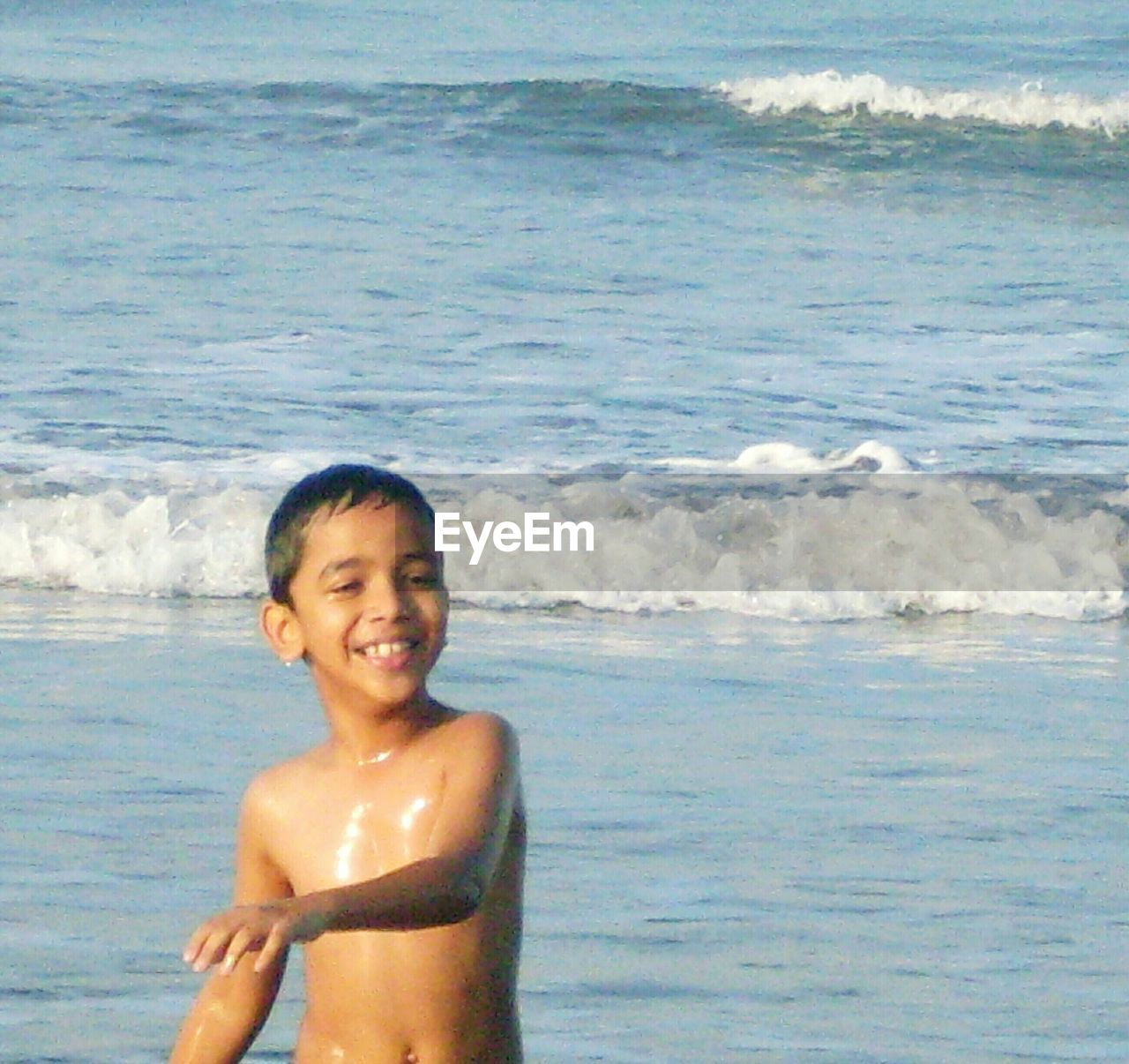 Boy playing at seaside