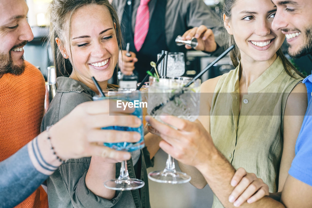 Friends toasting drinks at restaurant