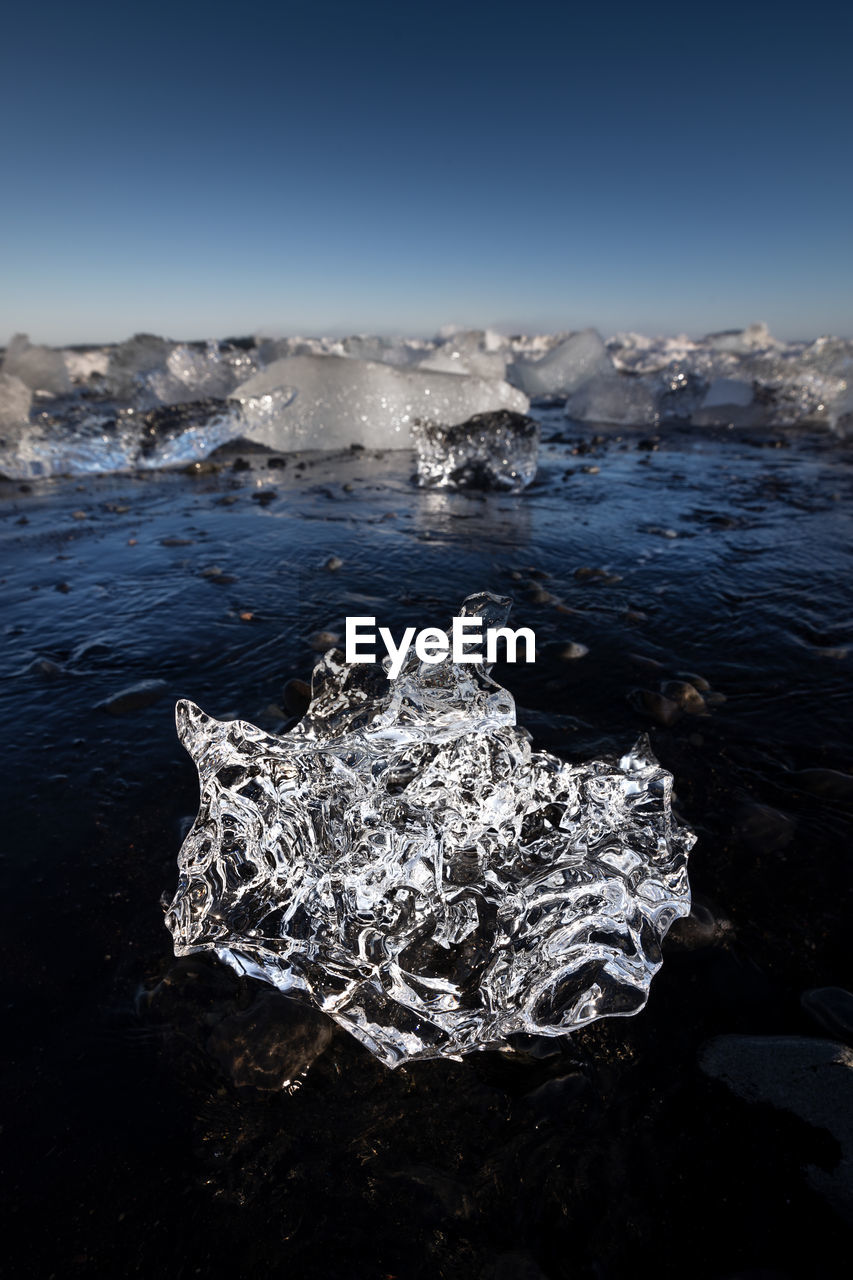 Picture of a shiny ice formation on the diamond beach in the jokulsarlon lagoon in iceland