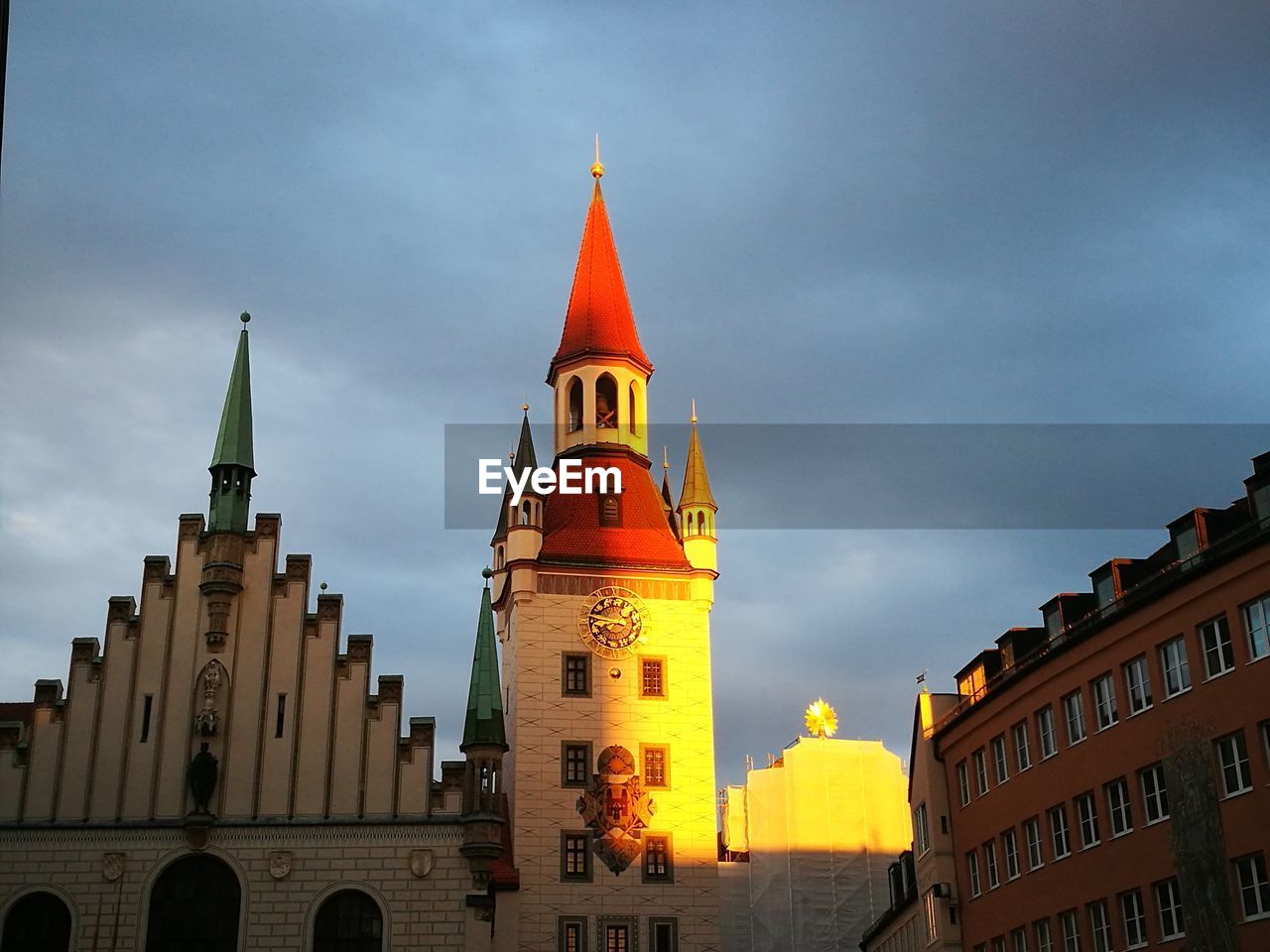 LOW ANGLE VIEW OF CATHEDRAL AGAINST CLOUDY SKY