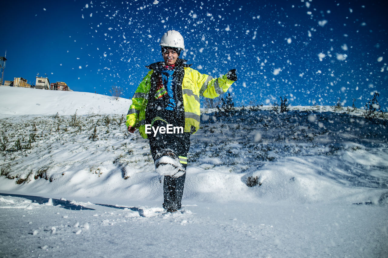 Photography of young woman having fun with snow