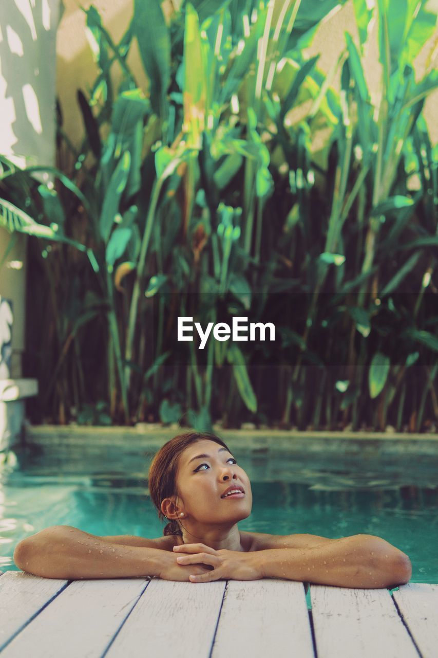 Woman relaxing in swimming pool