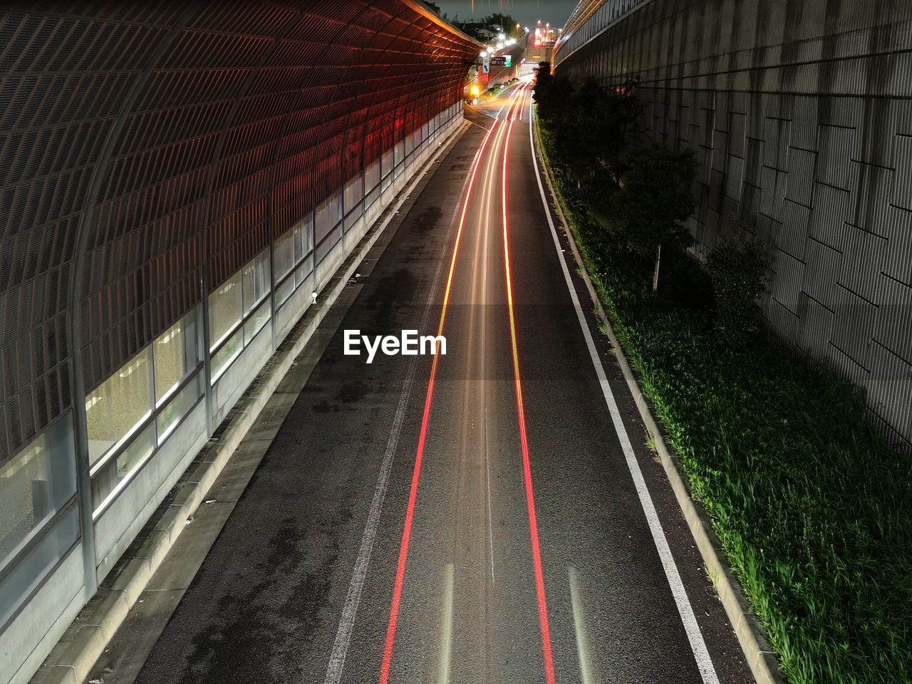 Light trails on road in city at night