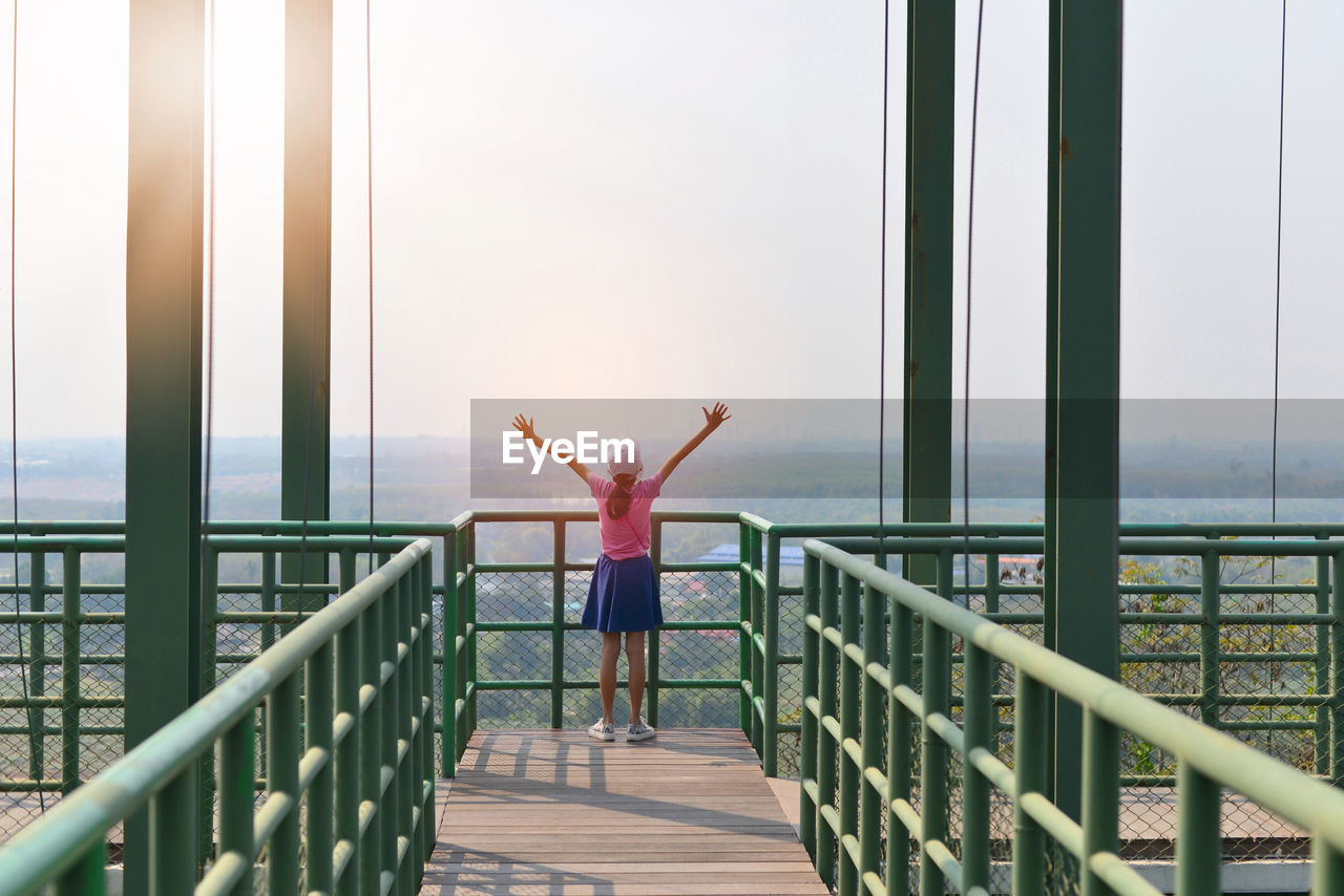 Rear view of girl standing at observation point 