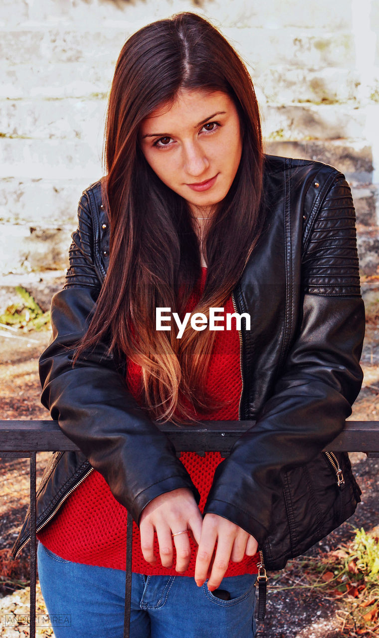 Portrait of beautiful young woman looking at the camera