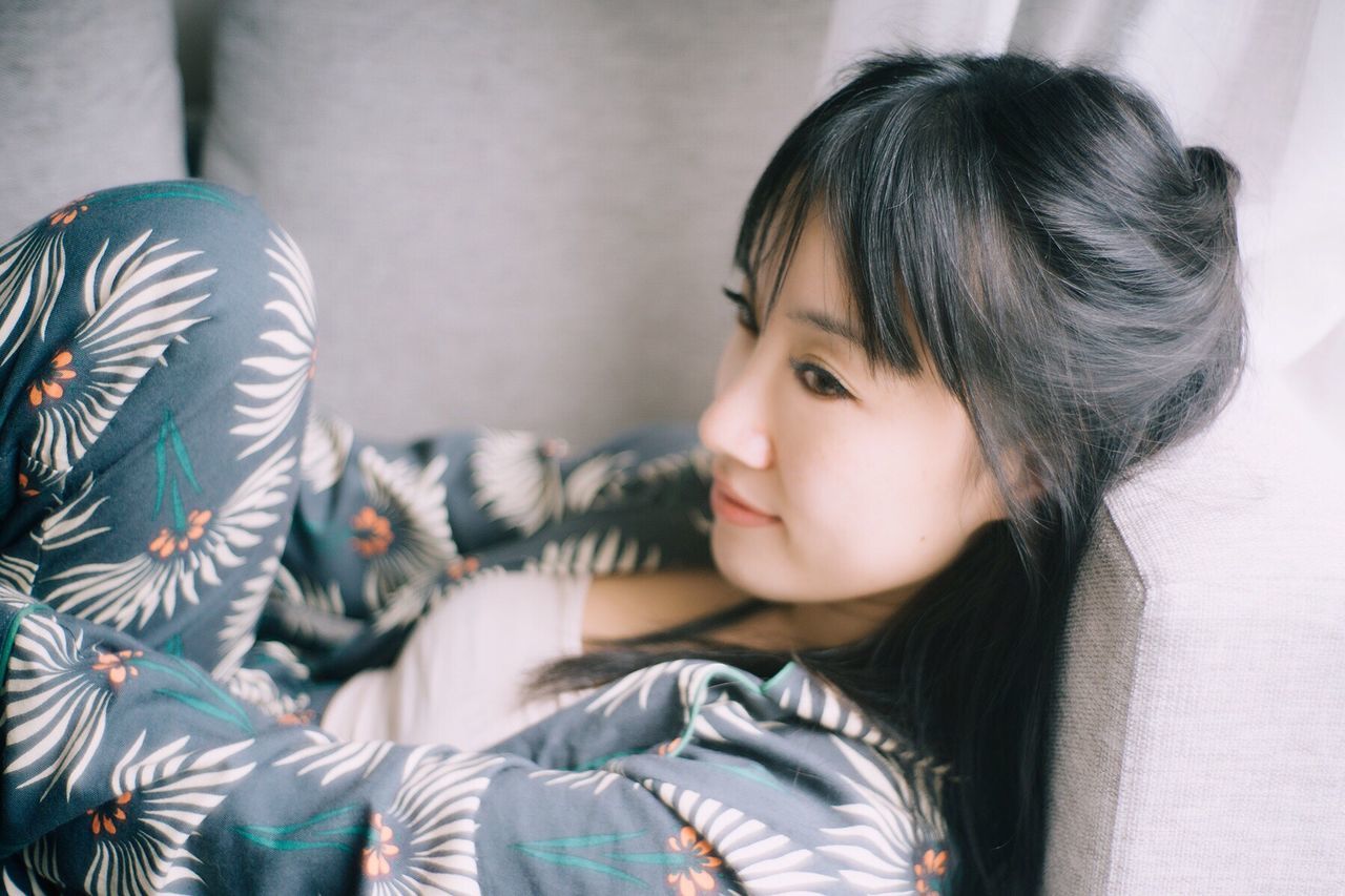 CLOSE-UP OF CUTE GIRL WEARING HOME AT BEDROOM
