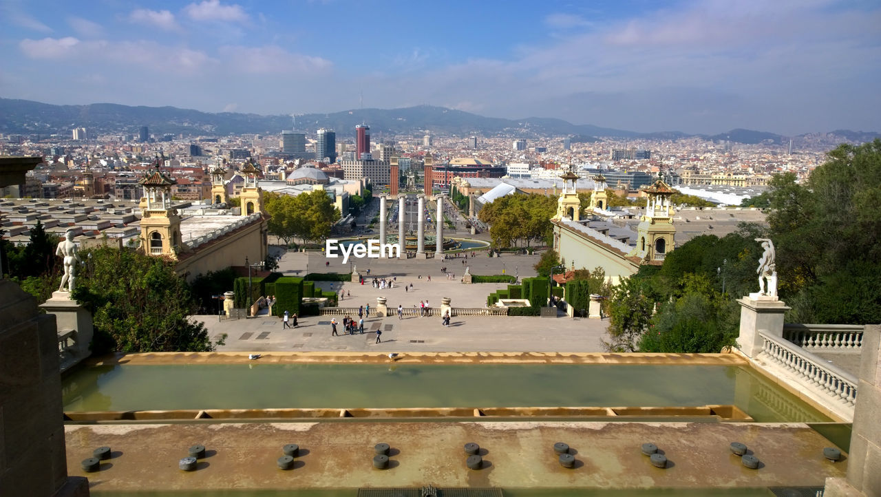 HIGH ANGLE VIEW OF BUILDINGS AGAINST SKY