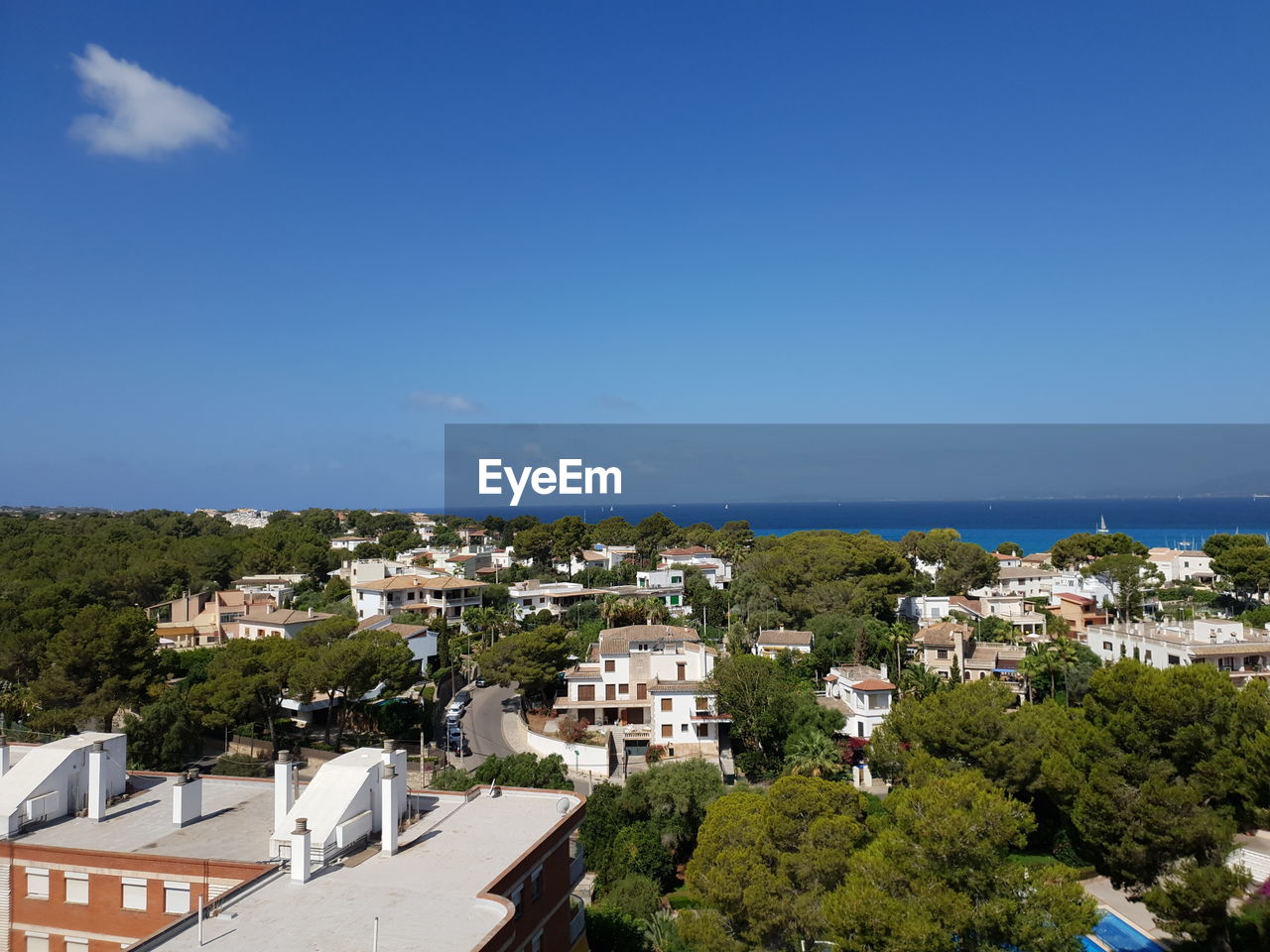 High angle view of townscape against blue sky