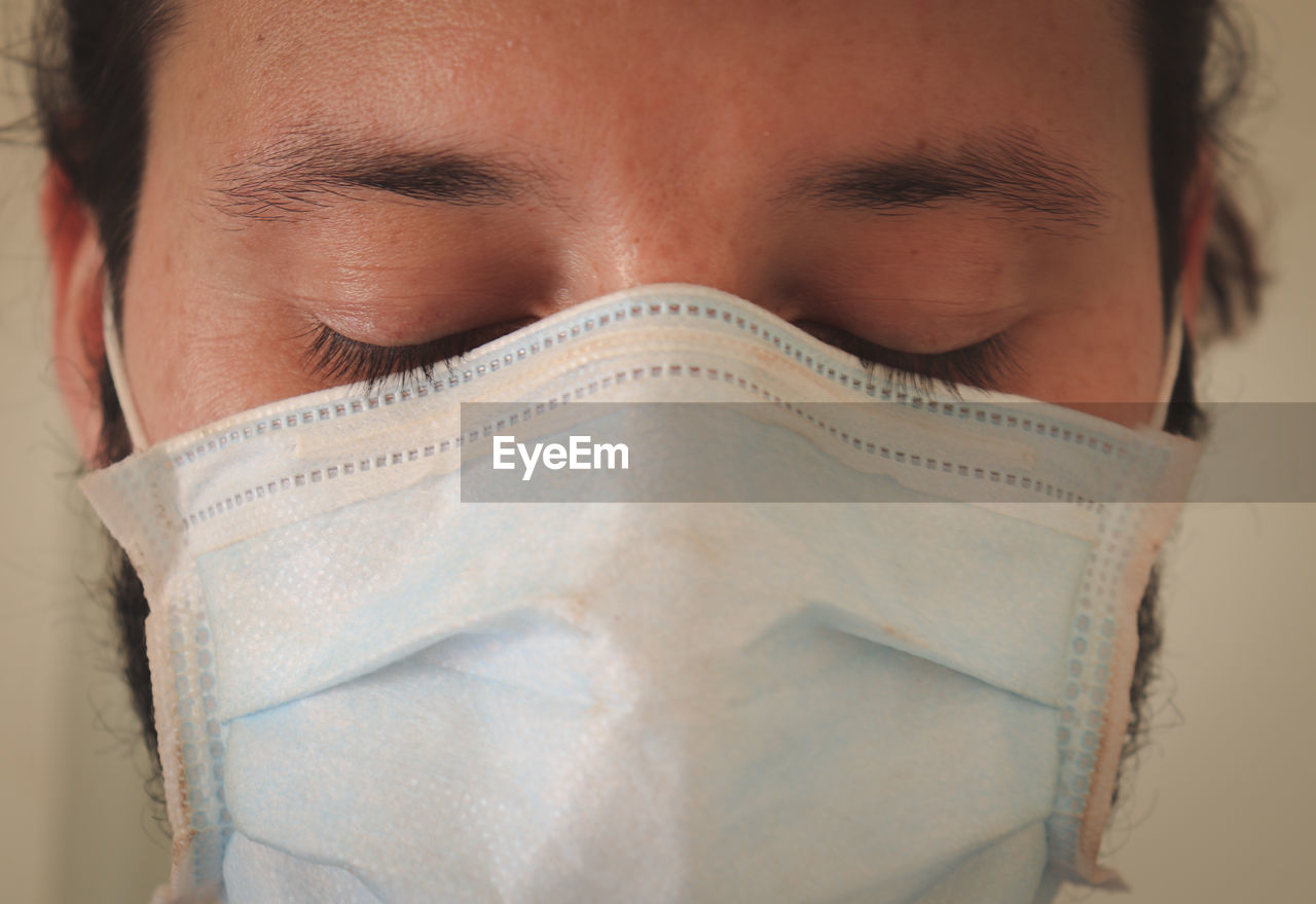 Close-up of man wearing surgical mask