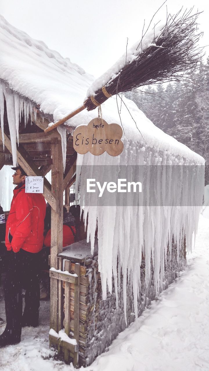 CLOTHES DRYING ON SNOW COVERED WITH TEXT