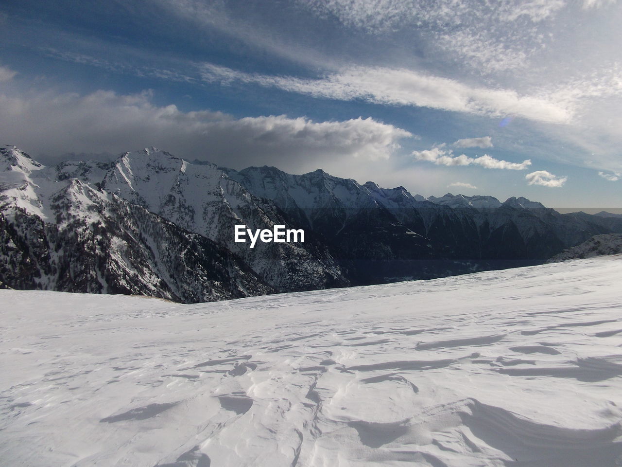 Scenic view of snowcapped mountains against sky