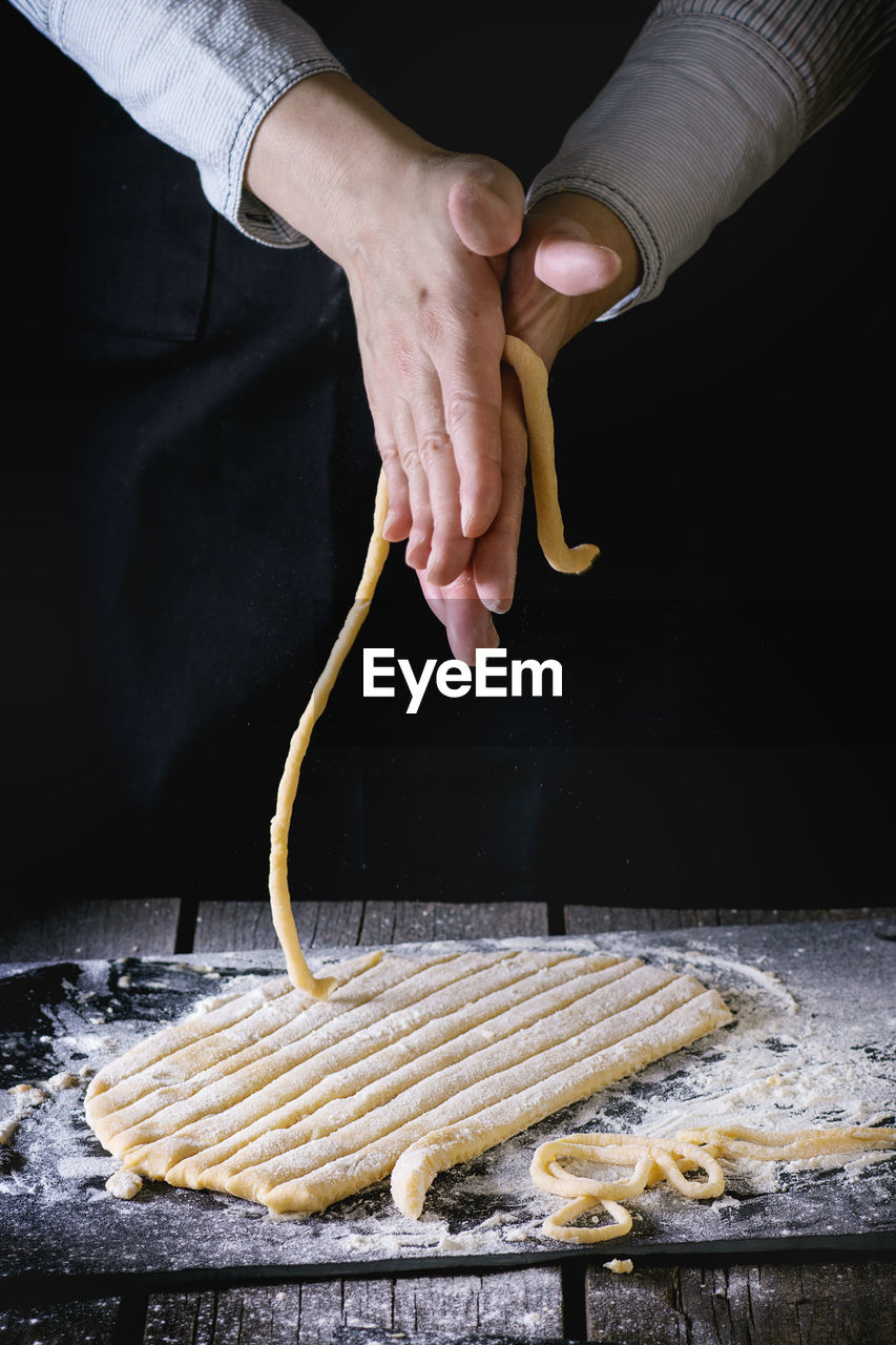 Midsection of man preparing food