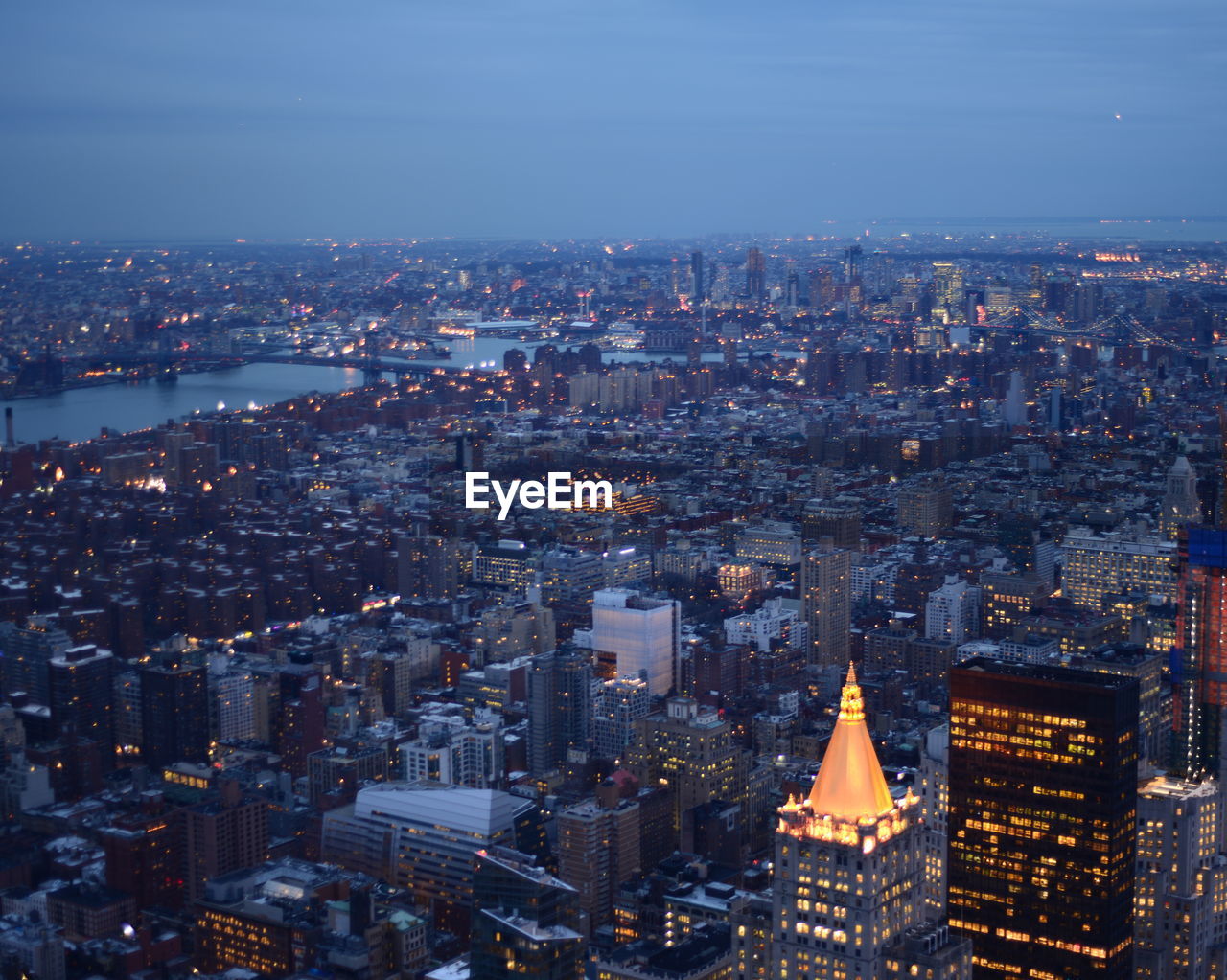 Aerial view of illuminated cityscape at dusk